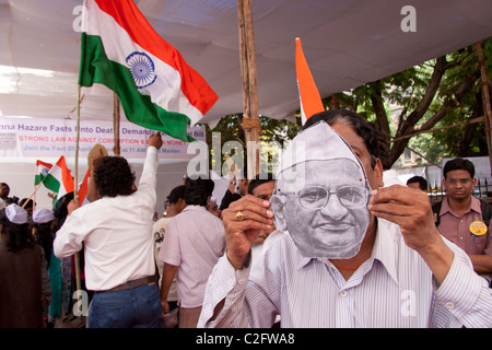 Anna Hazare's anti corruption rally supporters with his mask at Azad Maidan in Mumbai (Bombay), Maharashtra, India. Stock Photo