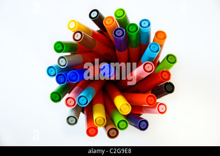 different coloured pens in a pot Stock Photo