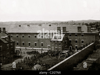 Washington, D.C. Execution of the conspirators: scaffold in use and crowd in the yard, seen from the roof of the Arsenal Stock Photo