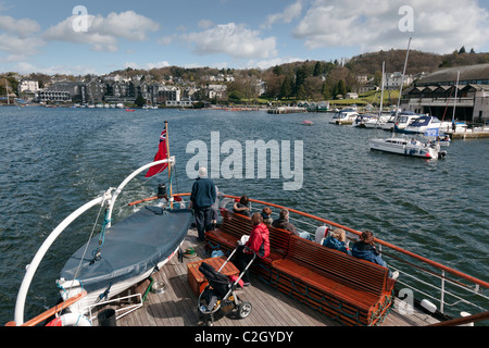 A steamer leaves the pier at Bowness on Windermere in the lake district . Stock Photo