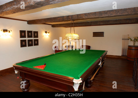 billiard table in luxury five star lodge The Manor at Ngorongoro, Shangri-La Estate, Tanzania, Africa Stock Photo