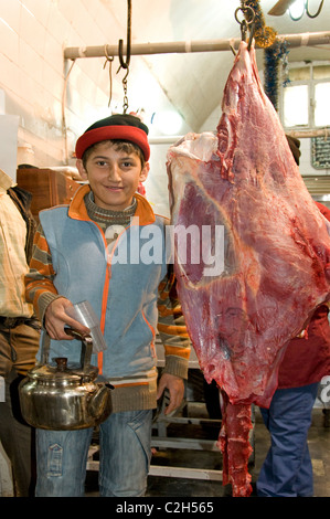 Homs Syria teapot kettle tea pot young boy butcher Stock Photo