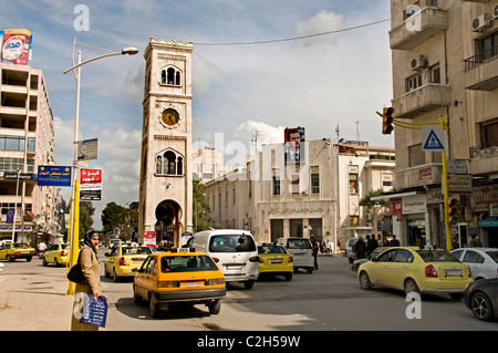 Hama Syria clock tower old city town center taxi Stock Photo