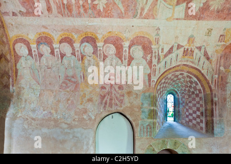 12th century fresco wall painting of six of the twelve apostles in the chancel of St Marys church. Kempley, Gloucestershire Stock Photo