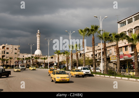 Hama Syria old new traffic taxi street city town Stock Photo
