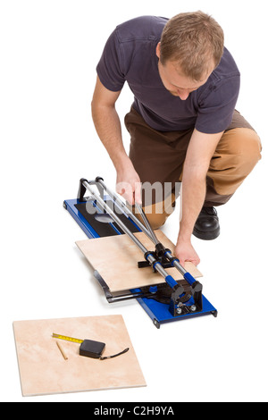 photo shot of man cut tiles Stock Photo