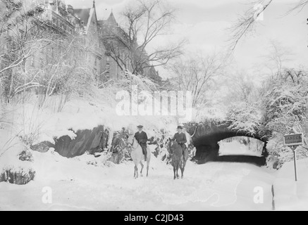 Two Horseback Riding during a Snowfall in Manhattan's Central Park Stock Photo