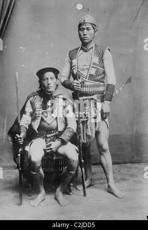 Two Formosan Tribal Chiefs in Native Garb pose Stock Photo