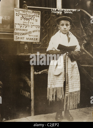 Jewish Boy in Prayer shawl and Sidur celebrates the Hebrew New Year Stock Photo