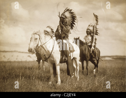 Sioux Chiefs on Horseback in full War Regalia Stock Photo