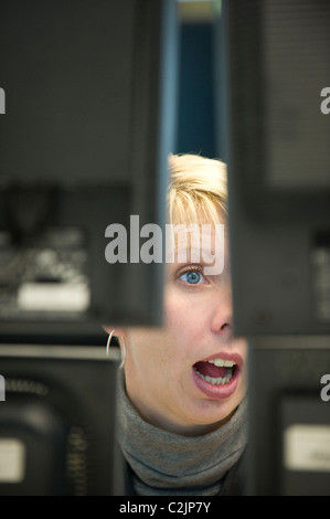 An equity trader at the screen of her computer, Frankfurt am Main, Germany Stock Photo