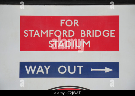 Sign in Fulham Broadway underground station pointing passengers towards the exit for Stamford Bridge Stadium. Stock Photo