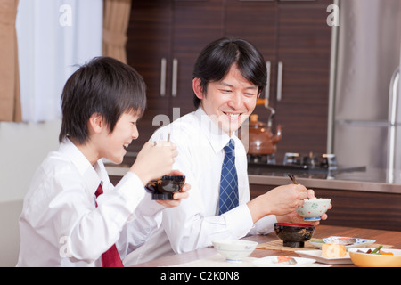 Father and Son Having Japanese Cuisine Breakfast Stock Photo