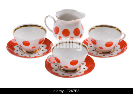 object on white - set of empty teacup with milk jug Stock Photo