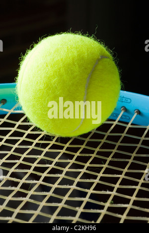 Tennis ball on racket. Stock Photo