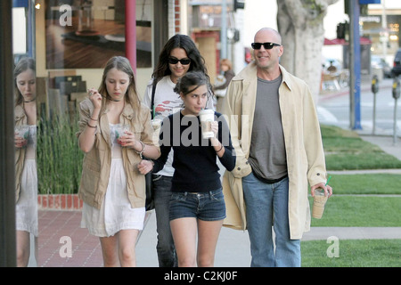 Bruce Willis, his girlfriend, daughter Tallulah Belle Willis pick up coffee at Starbucks and walk along Robertson Boulevard to Stock Photo