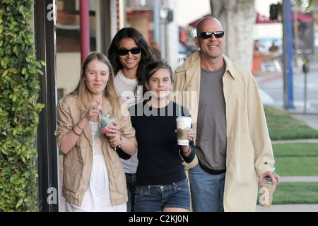 Bruce Willis, his girlfriend, daughter Tallulah Belle Willis pick up coffee at Starbucks and walk along Robertson Boulevard to Stock Photo