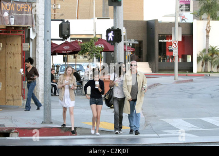 Bruce Willis, his girlfriend, daughter Tallulah Belle Willis pick up coffee at Starbucks and walk along Robertson Boulevard to Stock Photo