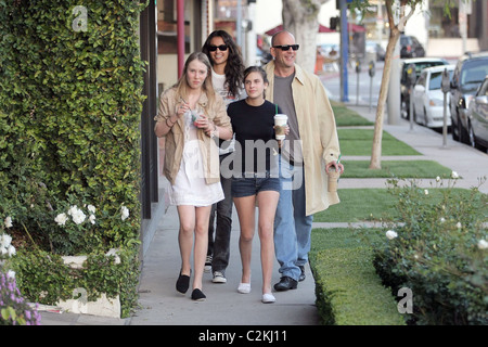 Bruce Willis, his girlfriend, daughter Tallulah Belle Willis pick up coffee at Starbucks and walk along Robertson Boulevard to Stock Photo