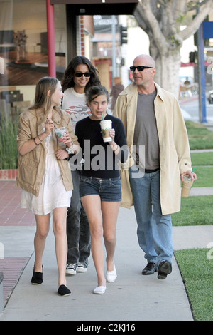 Bruce Willis, his girlfriend, daughter Tallulah Belle Willis pick up coffee at Starbucks and walk along Robertson Boulevard to Stock Photo