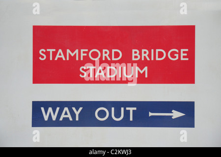 Digitally altered sign in Fulham Broadway underground station pointing passengers towards the exit for Stamford Bridge Stadium. Stock Photo