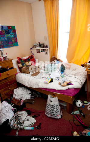 An untidy teenage girl university student's bedroom in her flat, UK Stock Photo
