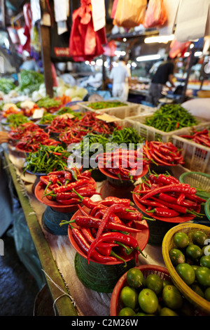 Chillies, fruit, vegetables, meat and fish for sale at the Chow Kit Market in Kuala Lumpur, Malaysia Stock Photo