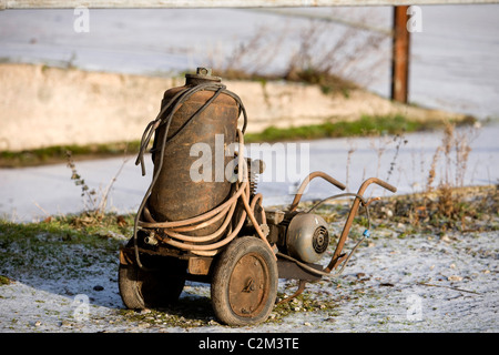 Old wheeled compressor Stock Photo