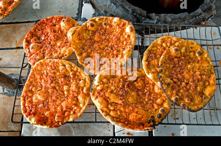 Bakery pancake pancakes pizza Syria desert Badiyat al Sham Bedouin Bedouins Villages woman Syrian Middle East Stock Photo