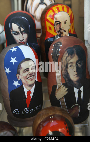 Wooden Matryoshka dolls bearing figures of famous figures for sale at a souvenir stall in Prague Czech republic Stock Photo