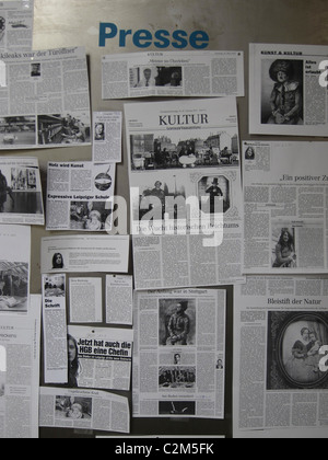 Stack of of newspapers tear sheet placed on a board in the University of Leipzig Saxony eastern Germany Stock Photo