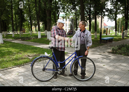Two old friends greeting each other Stock Photo