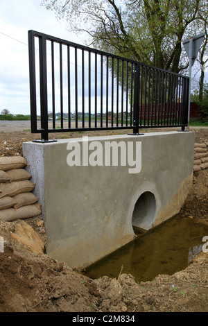 Culvert, channel water, underneath road, railway, embankment, drainage, running water, flooding, projects, land, works, tunnel, flood prevention, silt Stock Photo