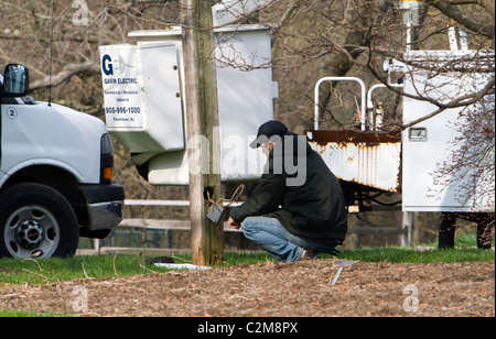 Electricians working outdoors. Stock Photo