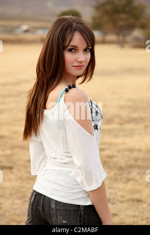 Pretty young Hispanic woman wearing a white blouse Stock Photo