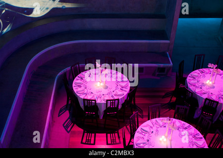 Matter, The O2 Arena, Peninsula Square, London. round tables with purple lights Stock Photo