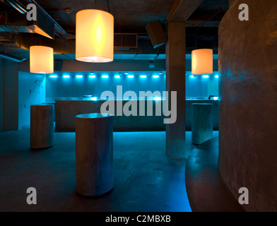 Matter, The O2 Arena, Peninsula Square, London. drum tables of concrete and bar Stock Photo