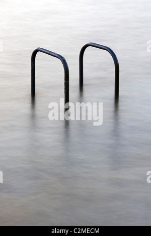 Hand rails at a tidal swimming pool in St Peters Port, Guernsey, The Channel Islands, UK Stock Photo