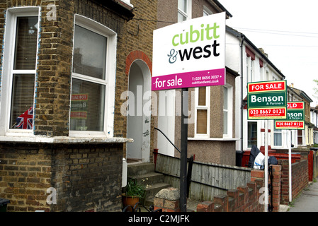 Property boards outside a row of houses in Croydon South London UK. Stock Photo