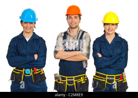 Constructor workers team standing with arms folded in a row and smiling isolated on white background Stock Photo