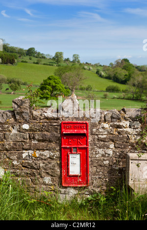 Post box in the countryside - Rural Victorian postbox in The Lake District, Cumbria, England, UK Stock Photo
