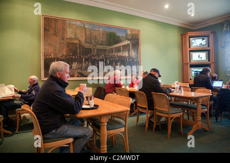 People sitting in the bar area bafore a sale at Tattersalls Horse sales, Tattersalls, Newmarket, Suffolk UK Stock Photo