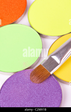 Make-up brush on professional eyeshadows , closeup Stock Photo