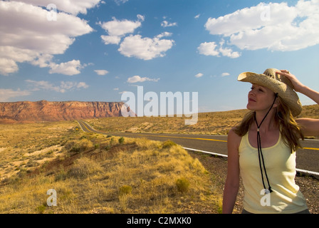 Attractive woman standing in the middle of nowhere Stock Photo