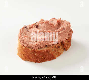 Slice of bread roll and liver pate Stock Photo