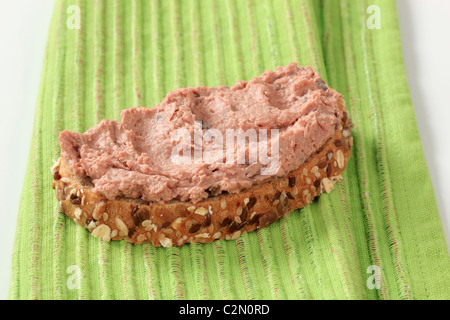 Slice of bread roll and liver pate Stock Photo