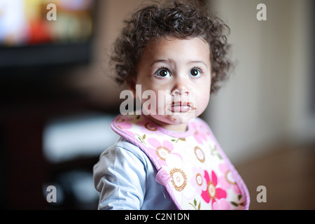 Girl With Chocolate On Her Face Stock Photo