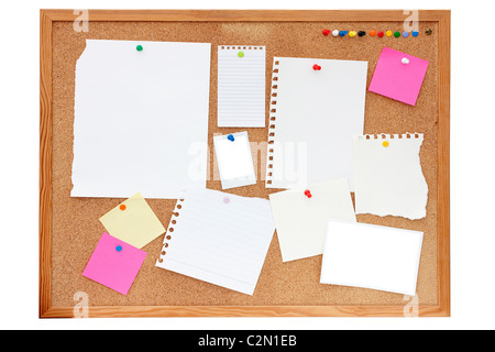 empty paper, documents, photos and notes pinned onto a pinboard or noticeboard Stock Photo