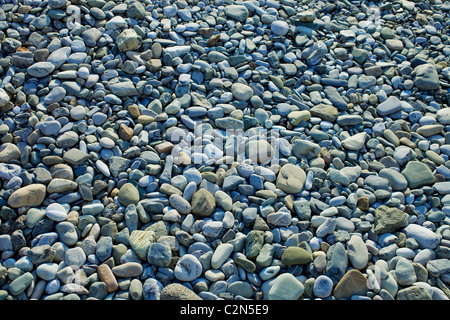 Surface covered with gray stones rounded pebbles closeup Stock Photo