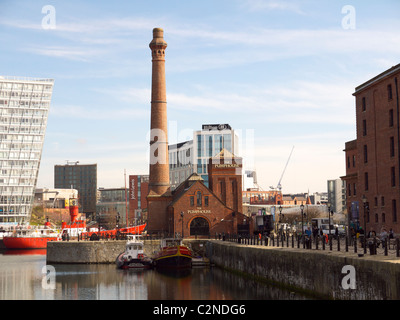 Old pumphouse in the Albert Dock in Liverpool, Liverpool One in the background Stock Photo